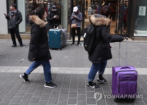 This photo, taken on March 5, 2017, shows Chinese tourists in Myeongdong, downtown Seoul. (Yonhap) 