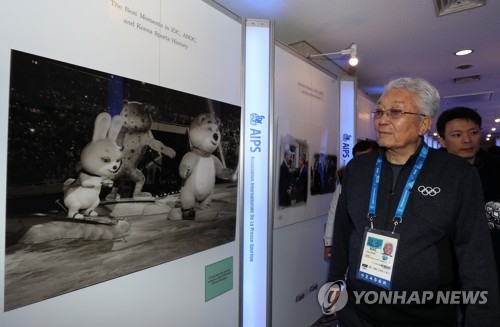 Chang Ung, the lone North Korean member of the International Olympics Committee, attends a sports diplomacy photo exhibition in Gangeung, a sub-host city of the PyeongChang Winter Olympics, on Feb. 12, 2018. (Yonhap)