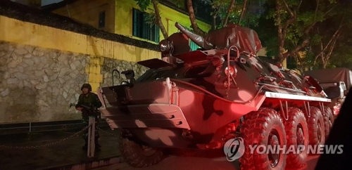An armored vehicle is stationed near the Melia Hanoi hotel in Hanoi on Feb. 26, 2019, as North Korean leader Kim Jong-un is expected to stay there. (Yonhap)