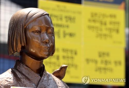 This photo, taken on April 21, 2021, shows a statue symbolizing victims of Japan's wartime sexual slavery in front of the Japanese Embassy in Seoul. (Yonhap)