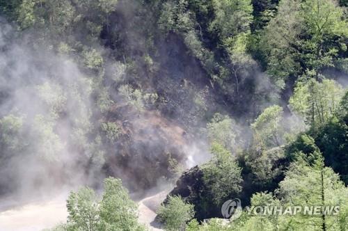 This file photo, taken May 24, 2018, shows detonation work at the Punggye-ri nuclear test site in North Korea. (Pool photo) (Yonhap)