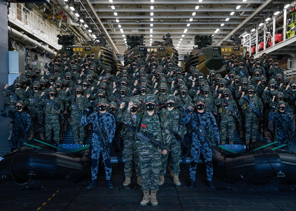 South Korean military personnel pose for a photo aboard the 14,500-ton Marado amphibious landing ship on May 31, 2022, before their departure for Hawaii to attend the biennial Rim of the Pacific Exercise (RIMPAC), in this photo released by the Navy. (PHOTO NOT FOR SALE) (Yonhap)