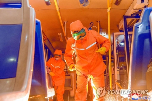 This file photo, released by North Korea's official Korean Central News Agency on June 4, 2022, shows workers sterilizing the inside of a train in Pyongyang. (For Use Only in the Republic of Korea. No Redistribution) (Yonhap)
