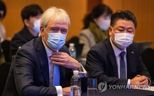 ASML President and CEO Peter Wennink (L) attends a press conference in Seoul on Nov. 15, 2022, a day before the company holds a groundbreaking ceremony for a new chip campus in Hwaseong, some 40 kilometers south of Seoul.