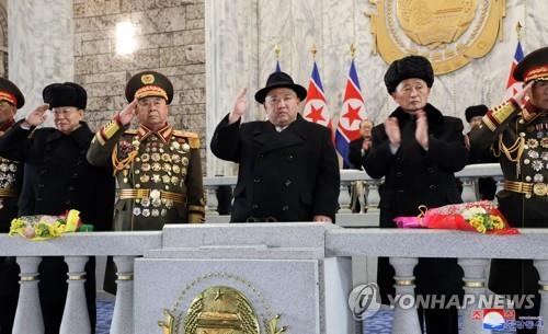 This photo, carried by North Korea's official Korean Central News Agency on Feb. 9, 2023, shows North Korean leader Kim Jong-un (C) overseeing a military parade in Pyongyang the previous day to mark the 75th founding anniversary of the North's armed forces. (For Use Only in the Republic of Korea. No Redistribution) (Yonhap)