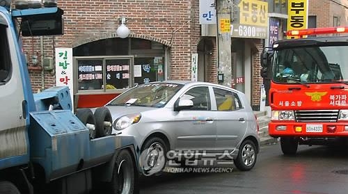 차량 견인 (연합뉴스 자료 사진)
