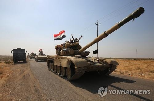 키르쿠크에 진입하는 이라크군의 탱크[AFP=연합뉴스자료사진]
