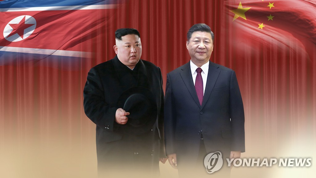 This image, provided by Yonhap News TV, shows Chinese President Xi Jinping (R) and North Korean leader Kim Jong-un. (Yonhap)