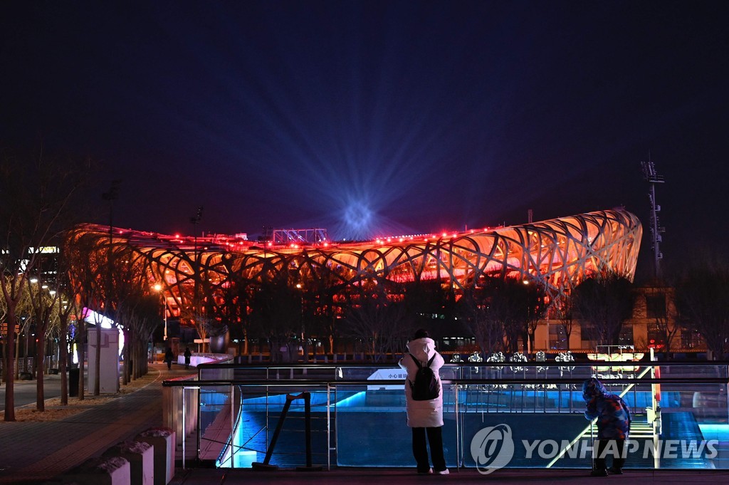 This AFP photo shows an illuminated National Stadium in Beijing, the venue for the opening and closing ceremonies of the 2022 Winter Olympics, on Jan. 15, 2022. (Yonhap)