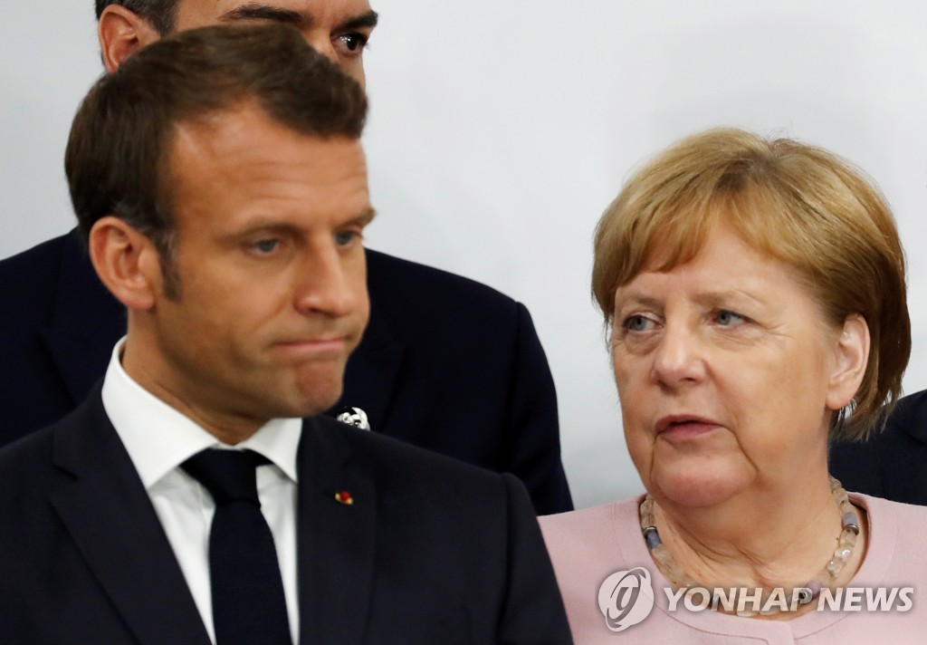 지난달 29일 일본 오사카 G20 정상회담의 에마뉘엘 마크롱 프랑스 대통령(왼쪽)과 앙겔라 메르켈 독일 총리(오른쪽) [로이터=연합뉴스]