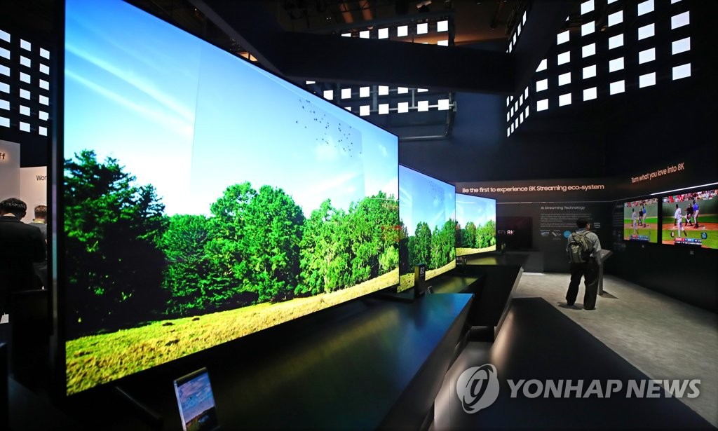 This file photo taken on Jan. 8, 2019, shows TVs displayed at Samsung Electronics Co.'s exhibition booth at CES 2019 in Las Vegas, Nevada. (Yonhap)