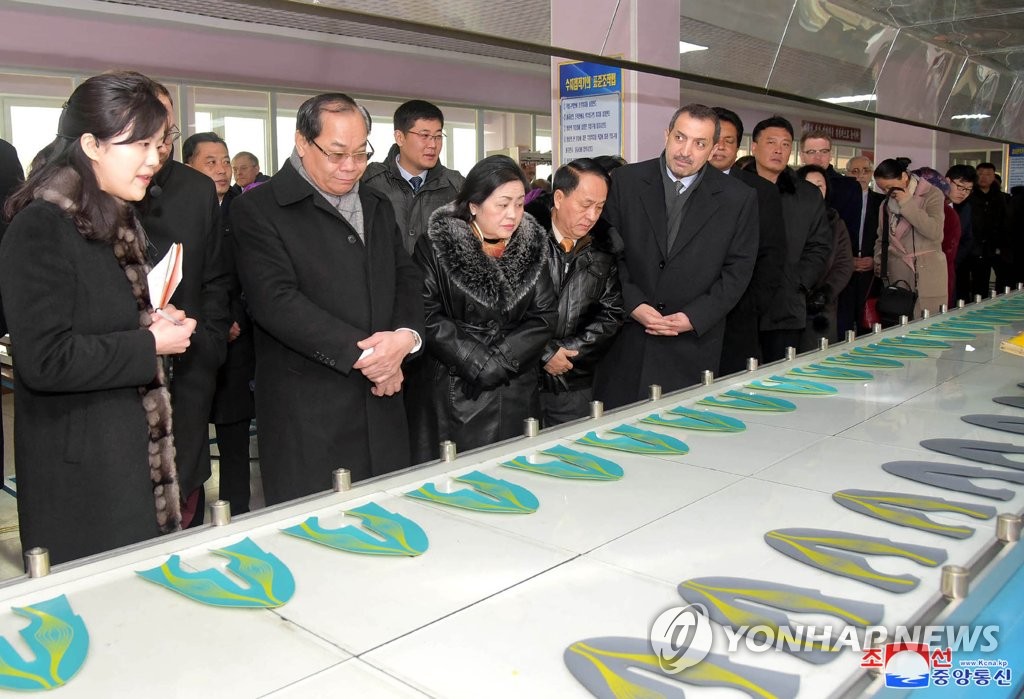 Envoys in NK visit shoe plant Envoys in NK visit shoe plant