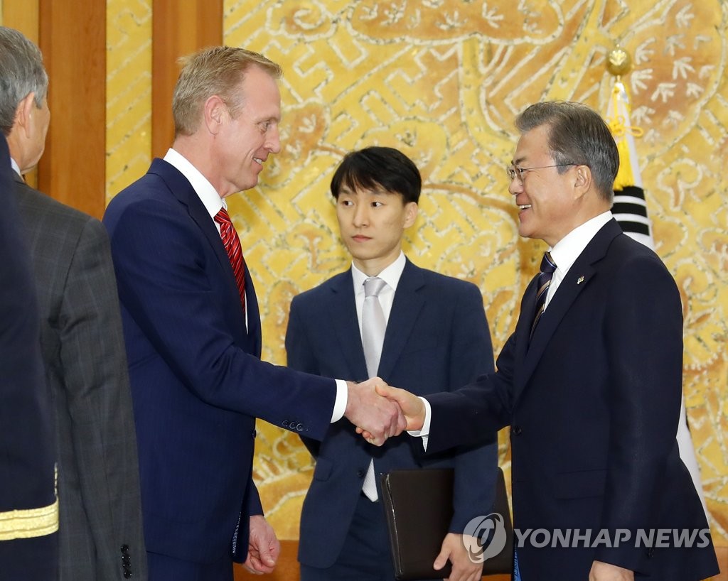 President Moon Jae-in shakes hands with acting U.S. Secretary of Defense Patrick Shanahan at Cheong Wa Dae in Seoul on June 3, 2019. (Yonhap)