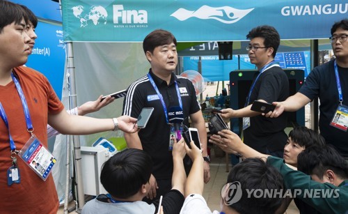 Kim In-kyun, head coach of the swimming club at North Gyeongsang Provincial Government, speaks to reporters at the athletes' village for the FINA World Championships in Gwangju, 330 kilometers south of Seoul, on July 17, 2019. (Yonhap)