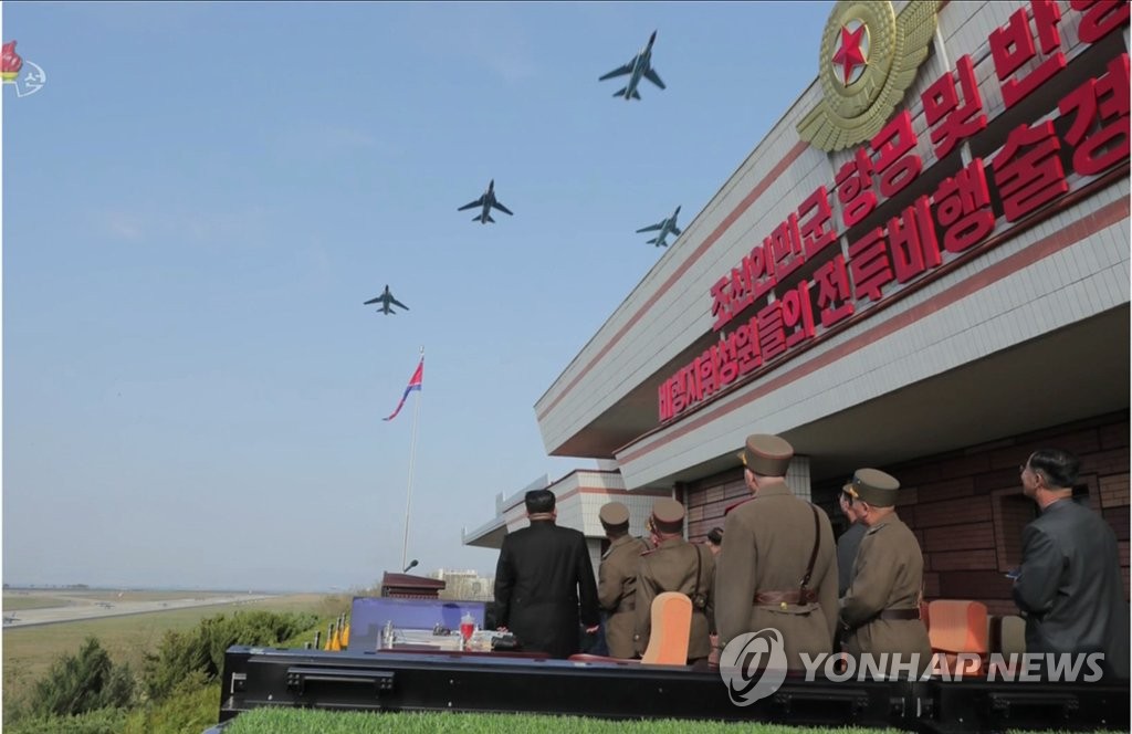 N. Korean leader watches air show N. Korean leader watches air show