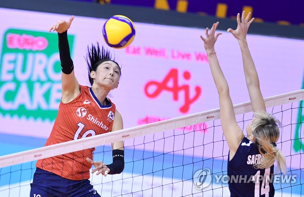In this photo provided by FIVB on Jan. 9, 2020, Kim Yeon-koung of South Korea (L) hits a spike against Alessya Safronova of Kazakhstan in their countries' Pool B match of the Asian Olympic women's volleyball qualification tournament at Korat Chatchai Hall in Nakhon Ratchasima, Thailand. (PHOTO NOT FOR SALE) (Yonhap)