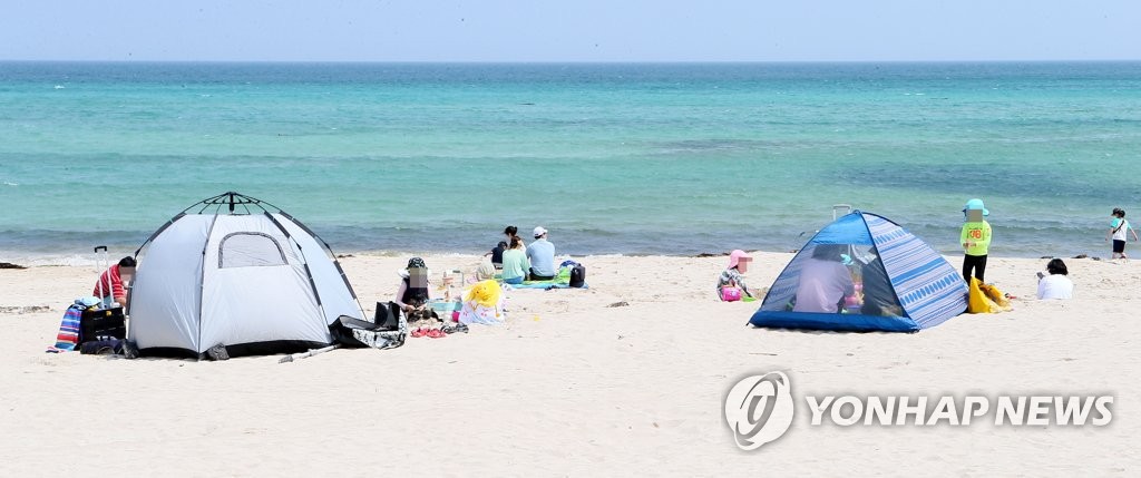 Social distancing on the beach Social distancing on the beach