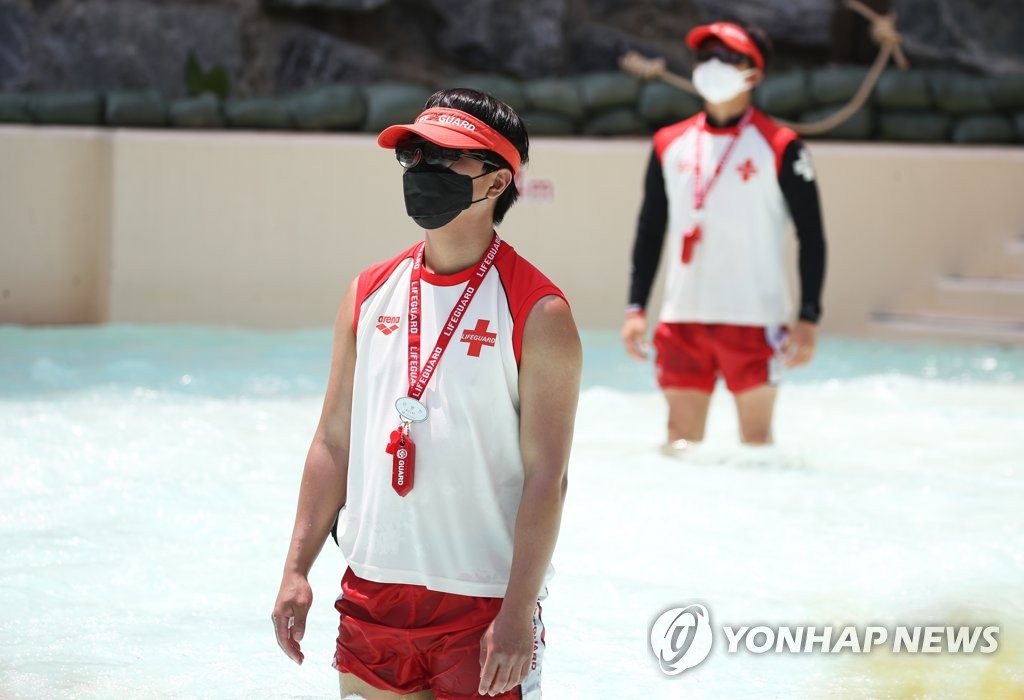 Water park lifeguards wear masks Water park lifeguards wear masks