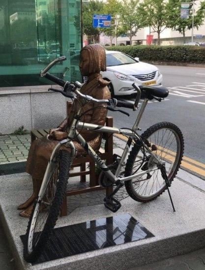 Bicycle chained to Statue of Peace Bicycle chained to Statue of Peace