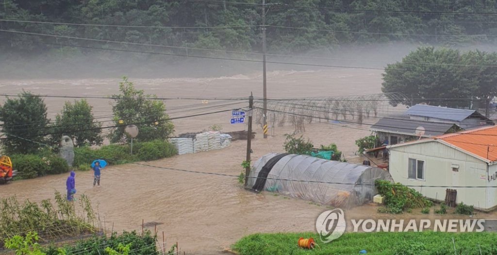 A village in Muju, North Jeolla Province, is inundated due to heavy rains on Aug. 8, 2020, in this photo provided by a local resident. (PHOTO NOT FOR SALE) (Yonhap)