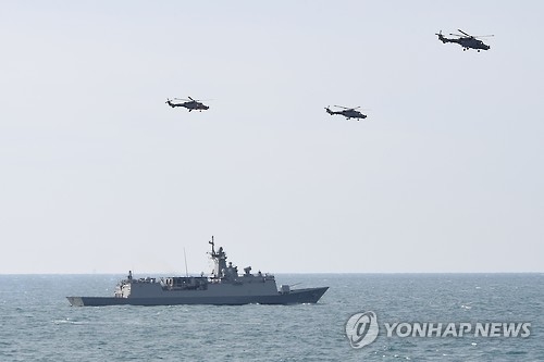 In this photo, taken on Feb. 1, 2017 and provided by the Navy, three AW-159 choppers fly over a frigate during a drill aimed at detecting enemy submarines in the southern seas off Geoje Island. (Yonhap) 