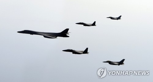 A U.S. bomber B-1B Lancer flies over Korea, alongside South Korea's F-15K and KF-16 fighters, in this file photo provided by South Korea's Air Force. (Yonhap)