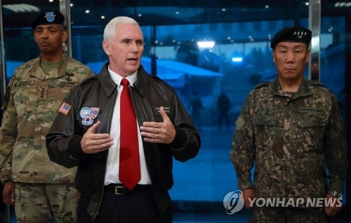 U.S. Vice President Mike Pence (C) speaks during his visit to the inter-Korean border village of Panmunjom within the Demilitarized Zone separating the two Koreas on April 17, 2017. (Pool photo) (Yonhap)