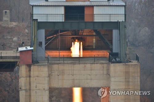 This photo carried by North Korea's state news agency on March 19, 2017, shows the North's ground test of a new high-thrust rocket engine. (For Use Only in the Republic of Korea. No Redistribution) (Yonhap)