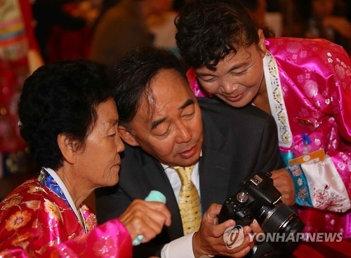 This file photo taken on Oct. 26, 2015, shows South and North Koreans taking part in family reunions for those separated by the 1950-53 Korean War at a hotel on Mount Kumgang in the North. (Yonhap)