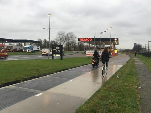 This photo shows the SolaRoad, a bike lane installed with 70 meters of a solar panel module underneath, in Krommenie, Netherlands. (Yonhap)