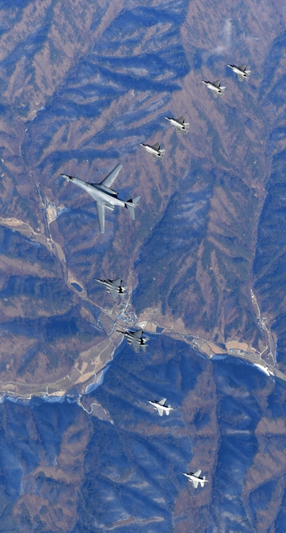 A U.S. supersonic B-1B bomber flies over Korea, flanked by several other warplanes of the allies, on Dec. 6, 2017, in this photo provided by South Korea's Air Force. (Yonhap)