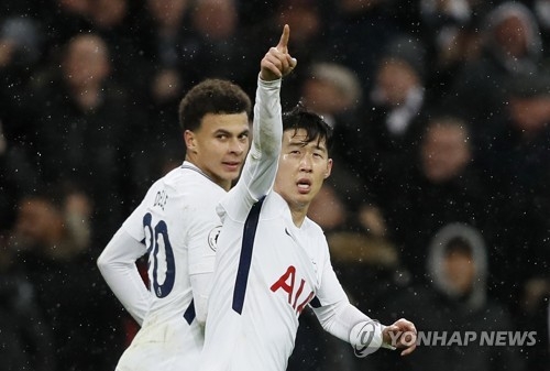 In this photo taken by the Associated Press, Tottenham Hotspur's Son Heung-min (R) celebrates after scoring his side's first goal during the English Premier League match between Tottenham Hotspur and West Ham United at Wembley Stadium in London on Jan. 4, 2018. (Yonhap) 