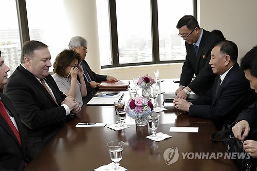 This Associated Press photo shows U.S. Secretary of State Mike Pompeo (L) meeting with Kim Yong-chol (R), vice chairman of the central committee of North Korea's ruling Workers' Party, in New York on May 31, 2018. (Yonhap)