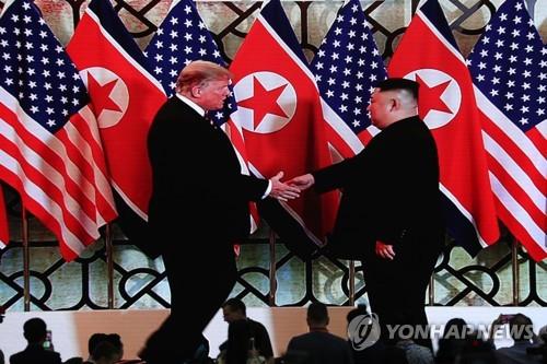 U.S. President Donald Trump (L) and North Korean leader Kim Jong-un shake hands before their meeting in Hanoi, Vietnam, on Feb. 27, 2019. (Yonhap)