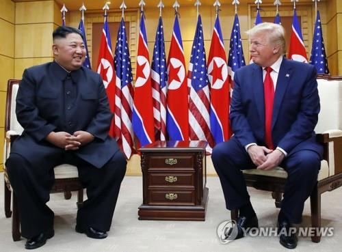 U.S. President Donald Trump (R) talks with North Korean leader Kim Jong-un at the Freedom House located on the southern side of Panmunjom on June 30, 2019. (Yonhap)