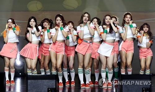 This image shows I.O.I when it was a 11-piece girl band. (Yonhap)