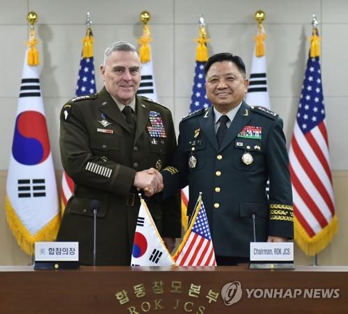 South Korea's Joint Chiefs of Staff (JCS) Chairman Gen. Park Han-ki (R) and his U.S. counterpart, Gen. Mark Milley, pose for a photo at the 44th Military Committee Meeting (MCM) at the JCS building in Seoul on Nov. 14, 2019, in this photo provided by the JCS. (PHOTO NOT FOR SALE) (Yonhap) 