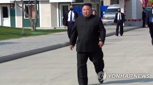 North Korea's state broadcaster Korean Central Television shows North Korean leader Kim Jong-un walking without the support of anyone at a fertilizer factory completion ceremony on May 1, 2020. (For Use Only in the Republic of Korea. No Redistribution) (Yonhap)