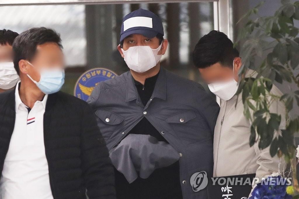 Kim Bong-hyun, owner of Star Mobility, is taken out of a detention room at Nambu Police Station in Suwon, south of Seoul, on April 24, 2020. (Yonhap)
