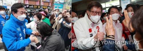 Kim Young-choon, the Democratic Party's Busan mayoral candidate (L), and his rival from the People Power Party Park Heong-joon rally support in Busan on April 1, 2021. (Yonhap)