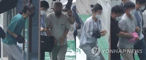 This Aug. 2, 2021, file photo shows four South Korean activists entering the Cheongju District Court, about 140 kilometers south of Seoul, to attend an arrest warrant hearing for allegedly taking orders from North Korea to stage anti-weapons protests. (Yonhap) 