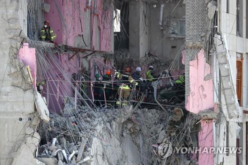 Rescuers collect another missing person at collapsed construction site in Gwangju