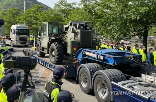 Power generators and other heavy equipment are transported to a Terminal High Altitude Area Defense (THAAD) base in Seongju County, North Gyeongsang Province, in this photo taken on April 28, 2021. (Yonhap)
