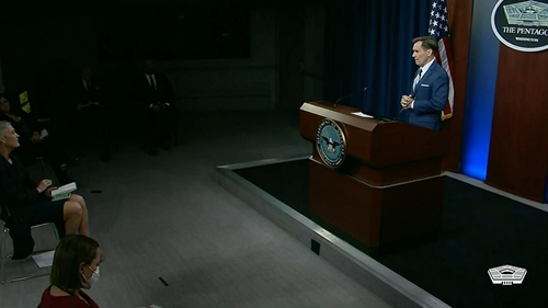 U.S. Department of Defense spokesperson John Kirby (R) is seen taking questions in a daily press briefing at the Pentagon in Washington on May 27, 2022 in this image captured from the department's website. (Yonhap)