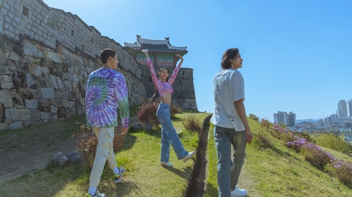 This image provided by the Cultural Heritage Administration shows three virtual influencer siblings -- Ho, Gon and Heil -- in a scene from a video promoting tourism to Hwaseong Fortress in Suwon, some 35 kilometers south of Seoul. (PHOTO NOT FOR SALE) (Yonhap) 
