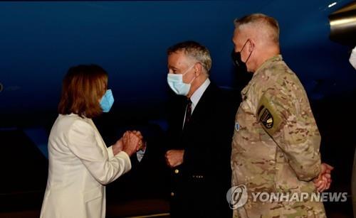 U.S. House Speaker Nancy Pelosi (L) is greeted by Philip Goldberg (C), U.S. ambassador to South Korea, and U.S. Forces Korea Commander Gen. Paul LaCamera (R) at Osan Air Base in Pyeongtaek, 70 kilometers south of Seoul, on Aug. 3, 2022, in this image captured from the U.S. Embassy in Seoul's Twitter page on Aug. 4. (PHOTO NOT FOR SALE) (Yonhap)