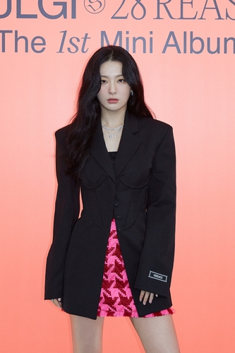 Seulgi of K-pop girl group Red Velvet poses for the camera during an online press conference to promote her solo debut EP, "28 Reasons," on Oct. 4, 2022, in this photo provided by SM Entertainment. (PHOTO NOT FOR SALE) (Yonhap)