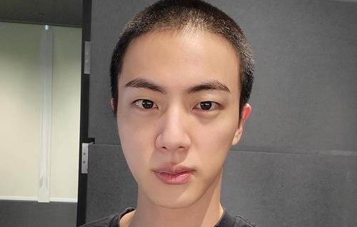 This photo of BTS member Jin with a military haircut was captured from Weverse, an online K-pop community platform. (PHOTO NOT FOR SALE) (Yonhap)