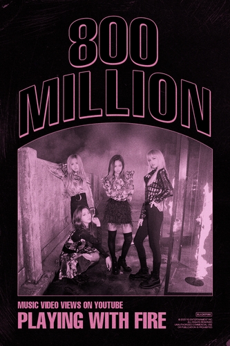 This photo provided by YG Entertainment shows a poster marking the music video for BLACKPINK's "Playing With Fire" having surpassed 800 million YouTube views. (PHOTO NOT FOR SALE) (Yonhap)