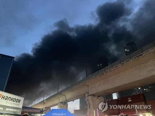 Smoke billows from a Hankook Tire Co. plant in the central city of Daejeon on March 13, 2023, after it was engulfed by a fire at 10:09 p.m. the previous day. (Yonhap)